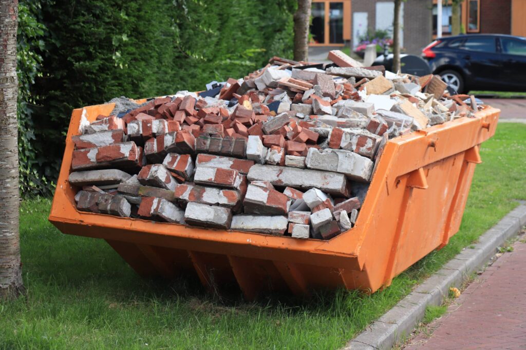 skip with bricks in